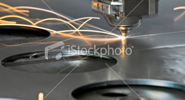 stock-photo-15463791-laser-metal-cutting-manufacturing-tool-in-operation